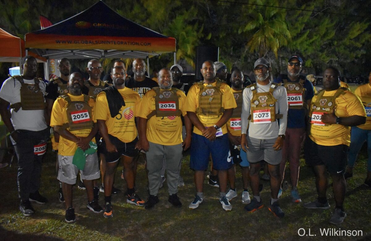 Participants in weighted vests line up before the start of the Fun Run Walk