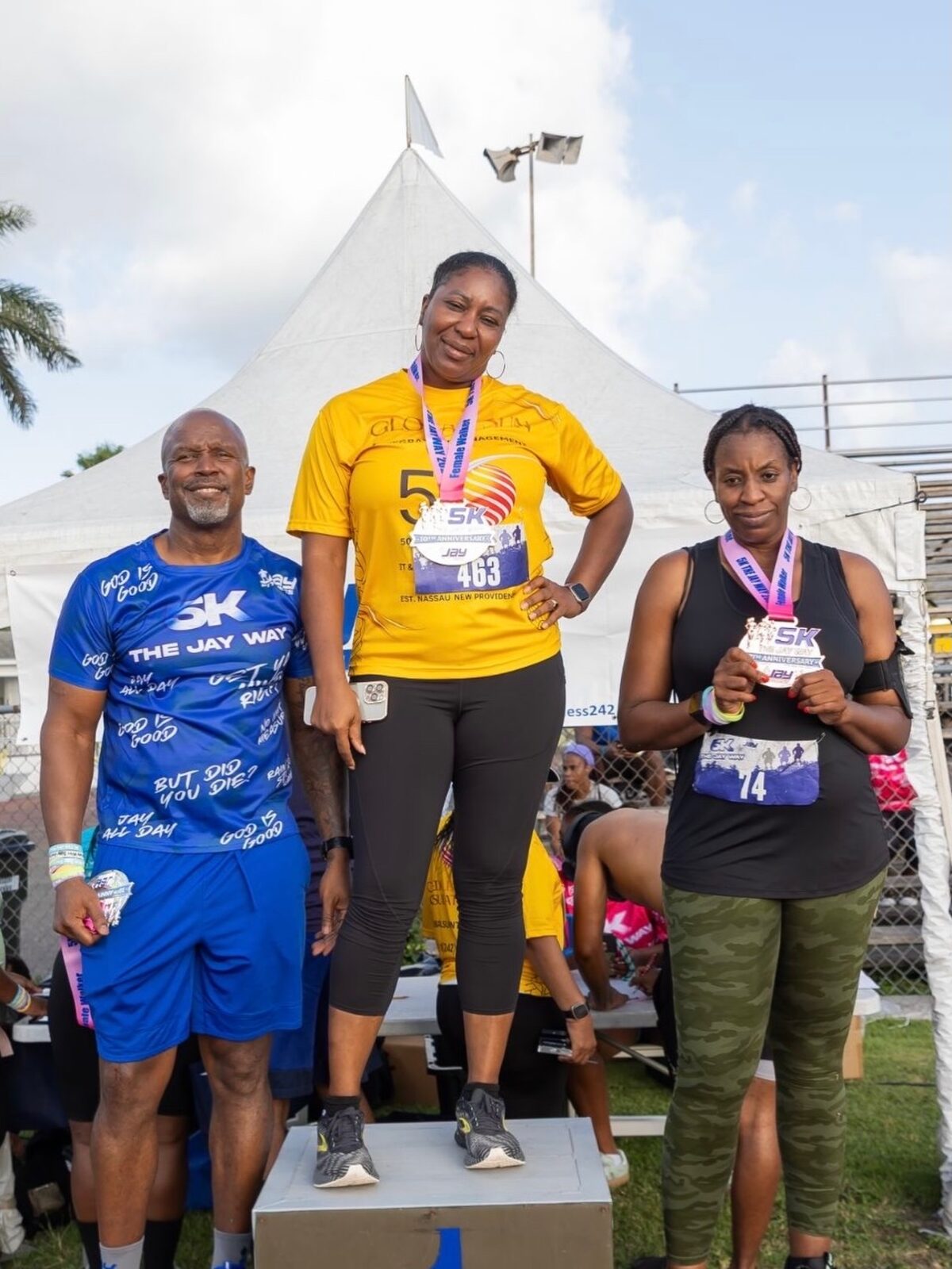 Female walker podium winners with their medals at the 5K The Jay Way