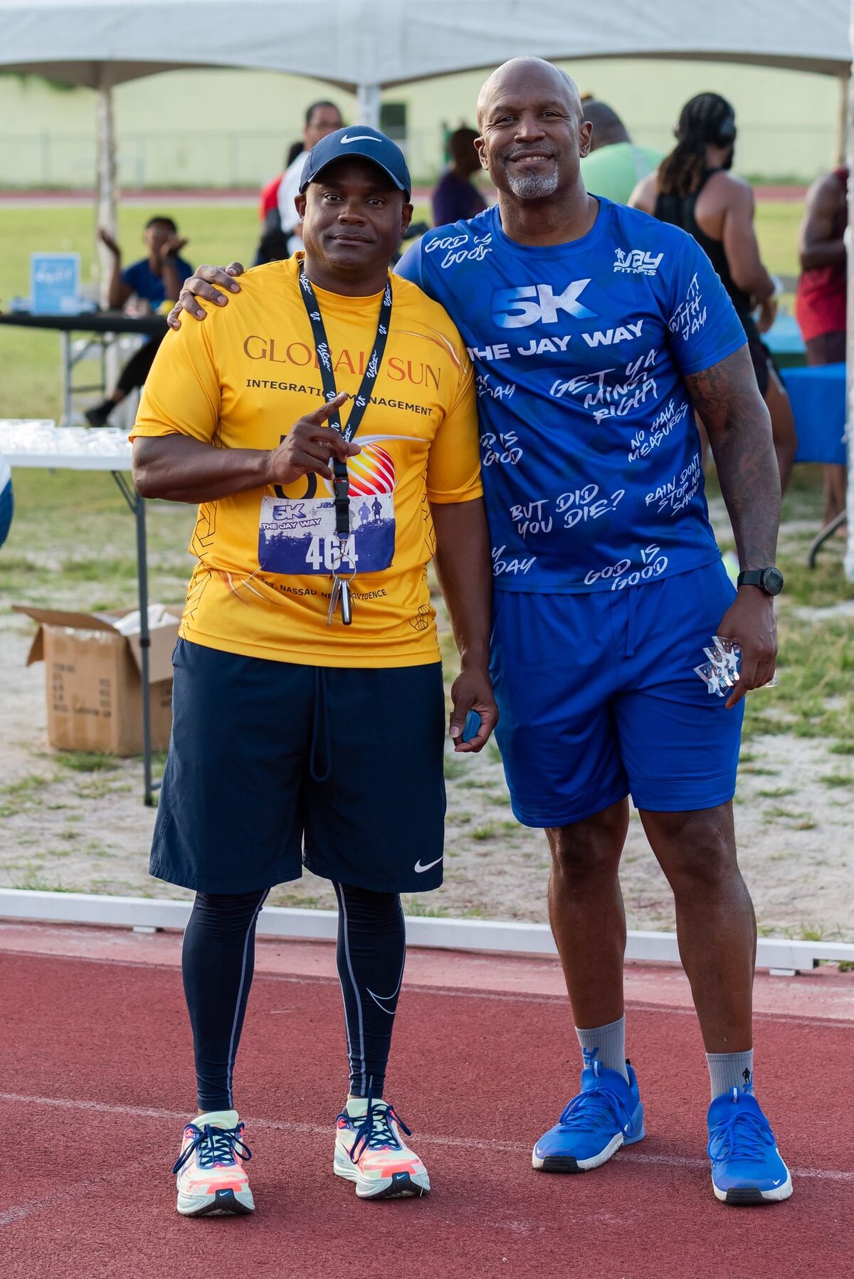 A Global Sun Integration participant with the 5K The Jay Way founder at the track